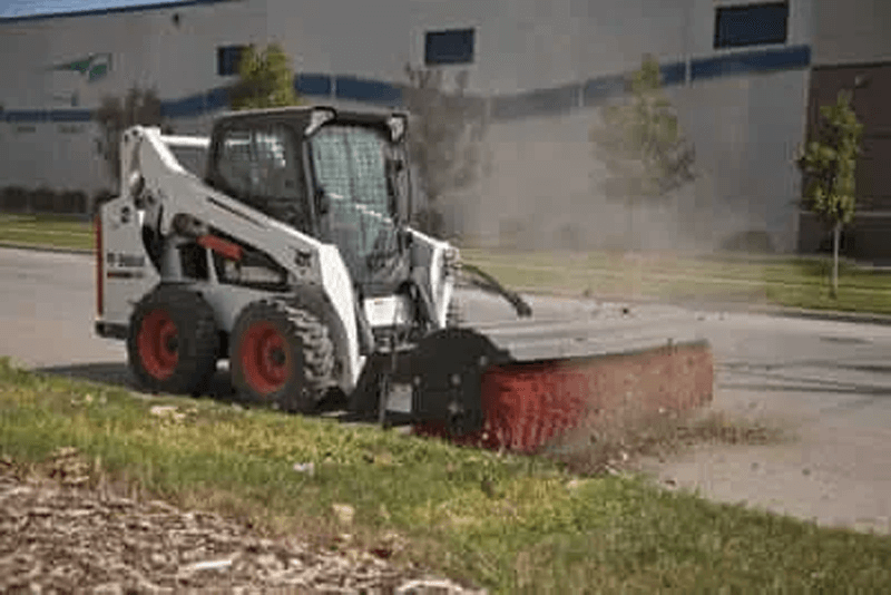 Skid steer broom attachments