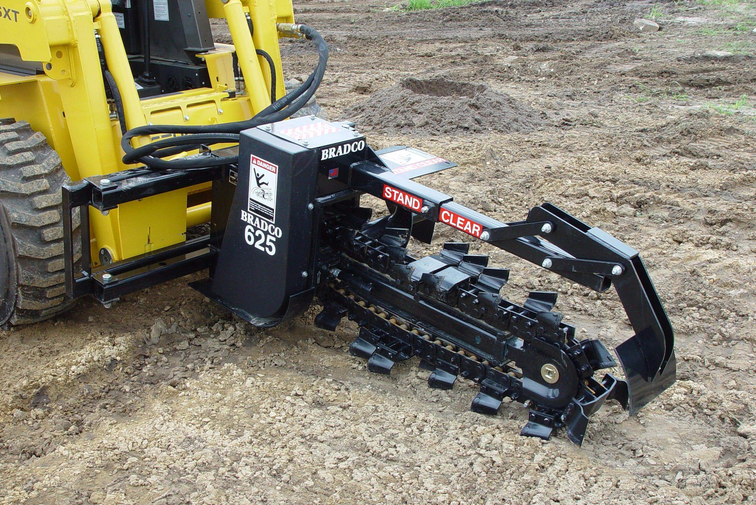 Skid steer trencher attachments