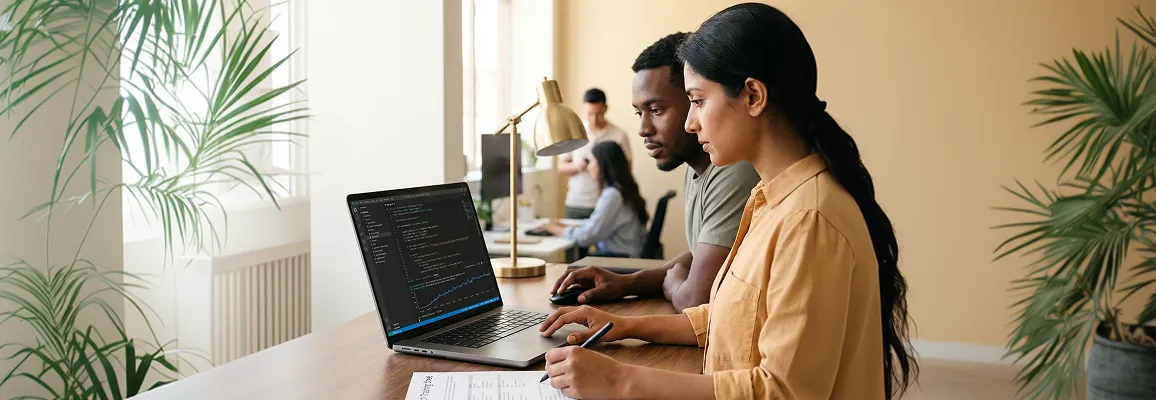 AI staff augmentation engineers working at standing desks with screen glow, focused posture, side angle AI staff augmentation engineers working at standing desks with screen glow, focused posture, side angle