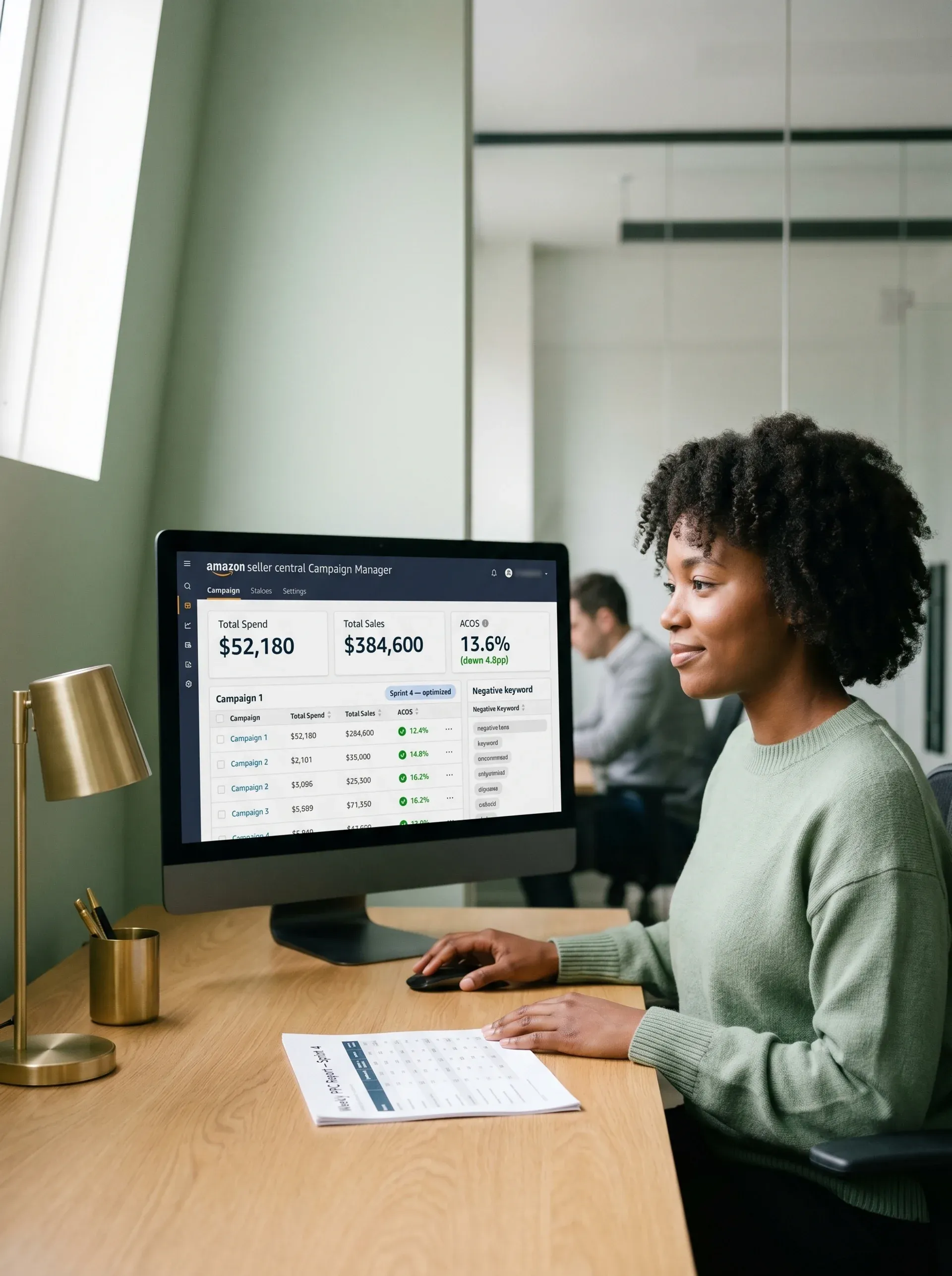 Amazon pay-per-click strategist reviewing optimized campaign results with visible relief and focus in natural desk light