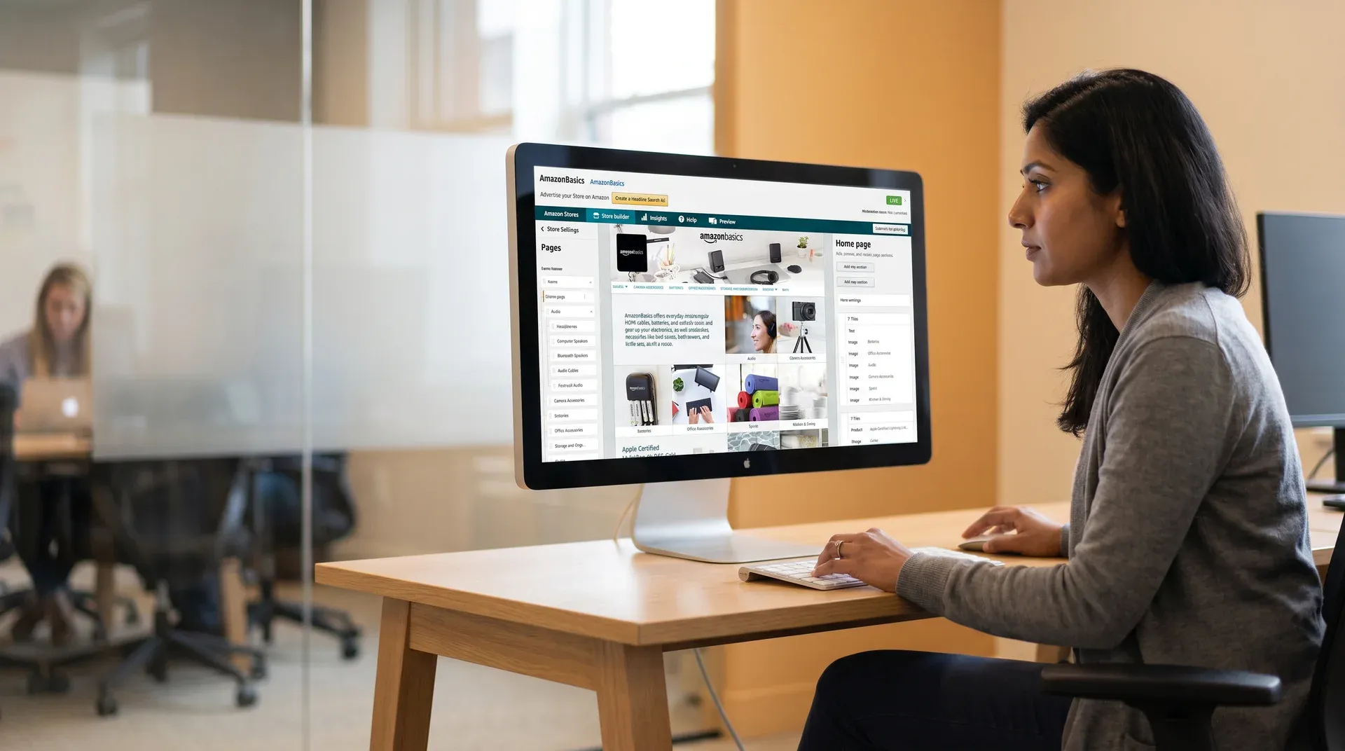 Brand designer at wide monitor reviewing Amazon storefront layout in natural side light, focused side profile Brand designer at wide monitor reviewing Amazon storefront layout in natural side light, focused side profile