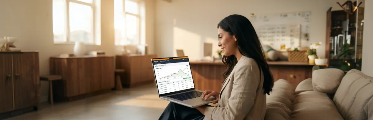 Ecommerce seller reviewing improved total advertising cost of sales and return on ad spend metrics on Amazon advertising dashboard on laptop after a pay-per-click audit Ecommerce seller reviewing improved total advertising cost of sales and return on ad spend metrics on Amazon advertising dashboard on laptop after a pay-per-click audit