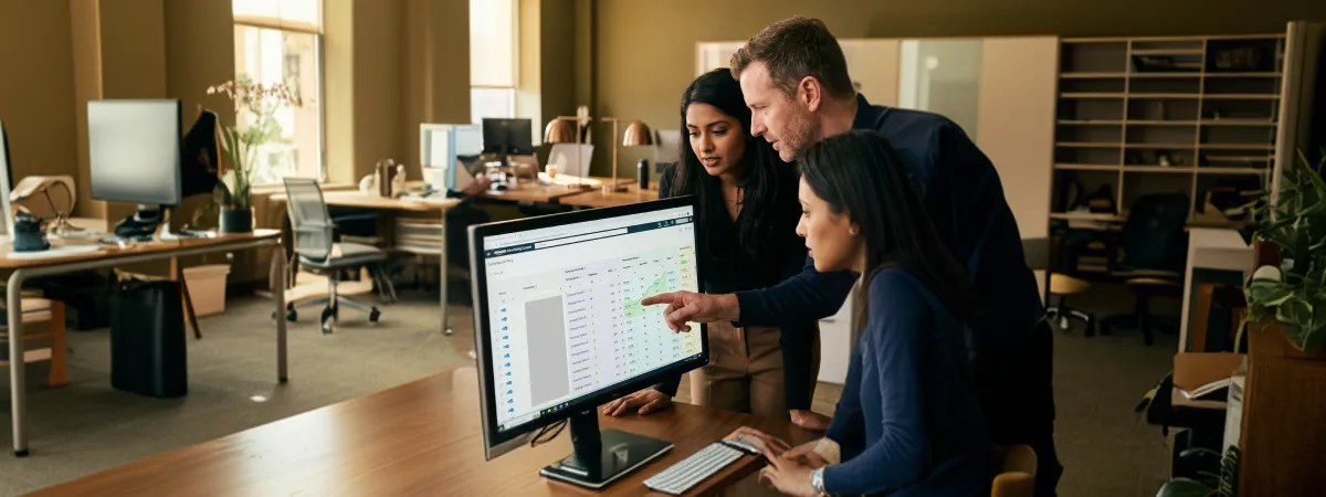 Advertising team reviewing improved Amazon pay-per-click campaign performance results after audit, natural office light, satisfied expressions Advertising team reviewing improved Amazon pay-per-click campaign performance results after audit, natural office light, satisfied expressions
