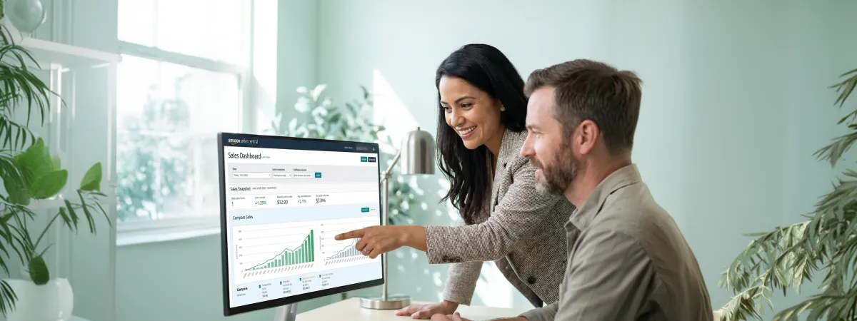Small ecommerce team reviewing strong combined BigCommerce and Amazon channel performance results on screen Small ecommerce team reviewing strong combined BigCommerce and Amazon channel performance results on screen