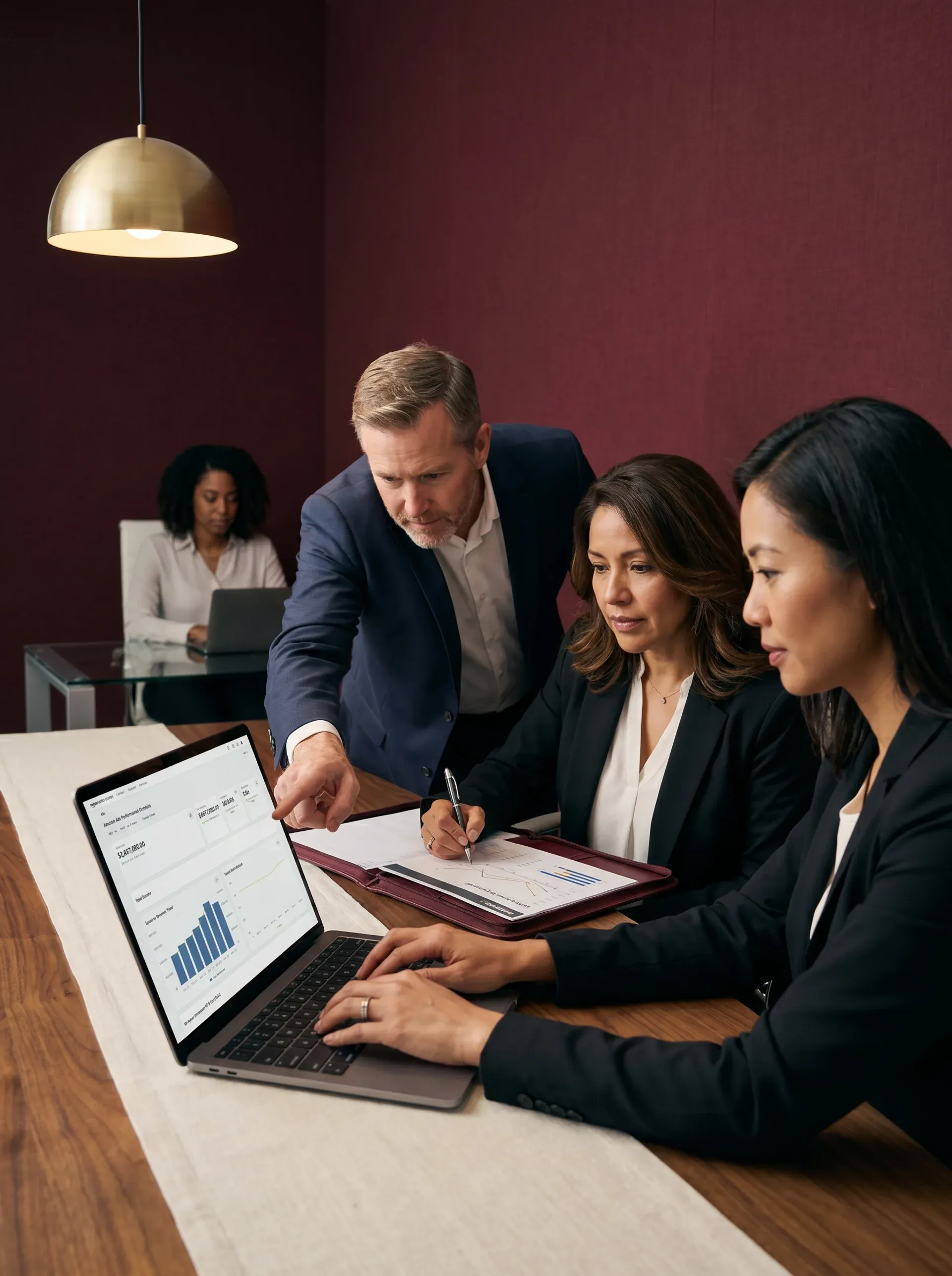 Brand and agency team reviewing Amazon full-service growth strategy at desk with reports and screens visible, natural side light Brand and agency team reviewing Amazon full-service growth strategy at desk with reports and screens visible, natural side light