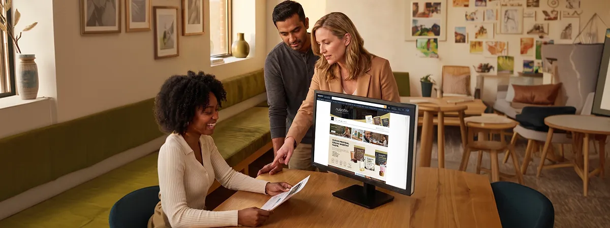 Creative designer building Amazon A+ content module layout in design software at workstation, focused expression, warm afternoon side light Creative designer building Amazon A+ content module layout in design software at workstation, focused expression, warm afternoon side light