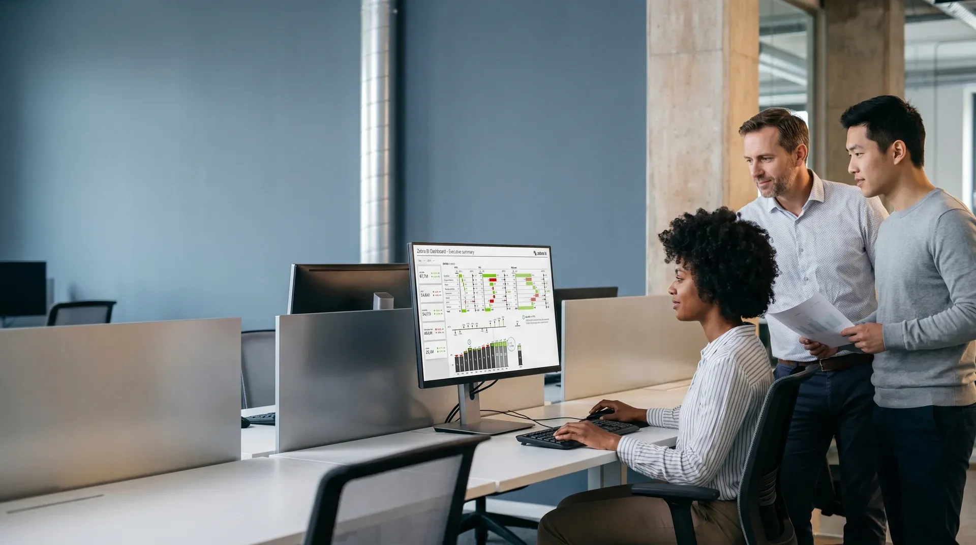 Operations team monitoring live enterprise data dashboards after digital transformation Operations team monitoring live enterprise data dashboards after digital transformation