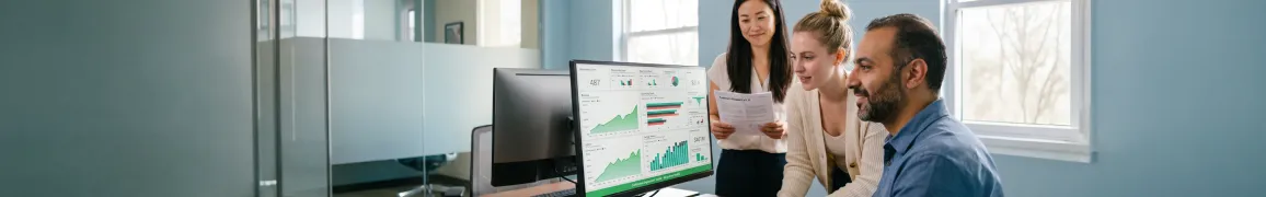 Engineering team reviewing modernized cloud-native system dashboard after successful legacy migration launch with expressions of relief Engineering team reviewing modernized cloud-native system dashboard after successful legacy migration launch with expressions of relief