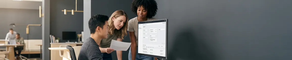Engineering team reviewing deployment metrics and pipeline dashboards in a bright open workspace Engineering team reviewing deployment metrics and pipeline dashboards in a bright open workspace
