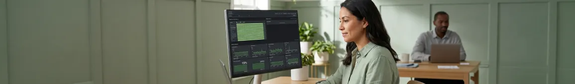 Cloud operations engineers monitoring live migration dashboard in dark atmospheric data center environment Cloud operations engineers monitoring live migration dashboard in dark atmospheric data center environment