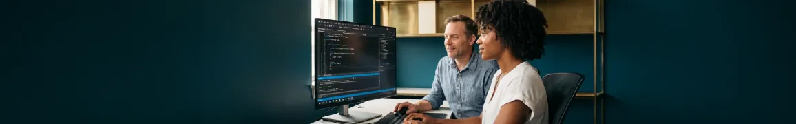 .NET solution architect reviewing Azure deployment architecture diagram at large monitor in modern office with natural window light .NET solution architect reviewing Azure deployment architecture diagram at large monitor in modern office with natural window light