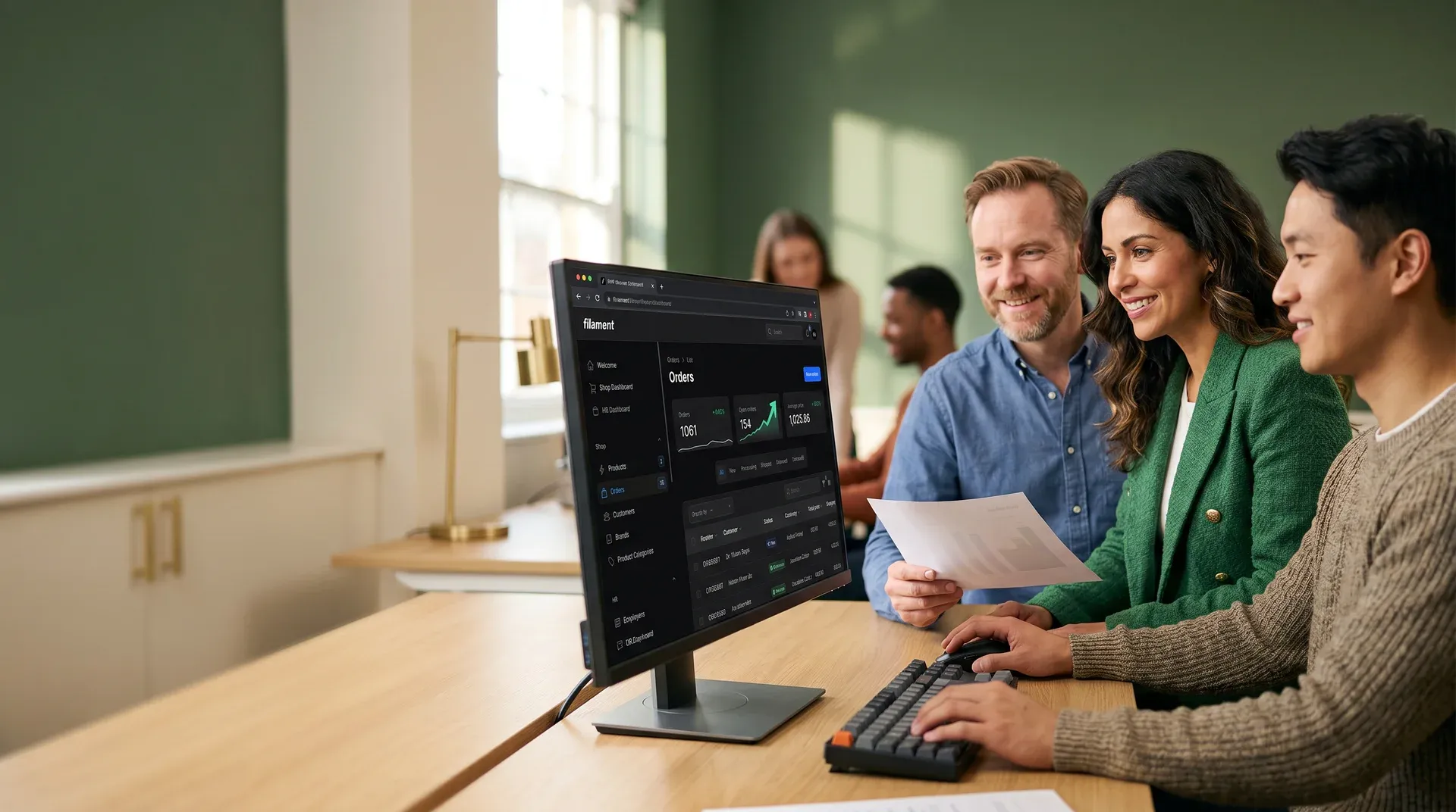 E-commerce platform team reviewing revenue growth dashboard on large monitor with satisfied expressions in modern office with natural afternoon light E-commerce platform team reviewing revenue growth dashboard on large monitor with satisfied expressions in modern office with natural afternoon light